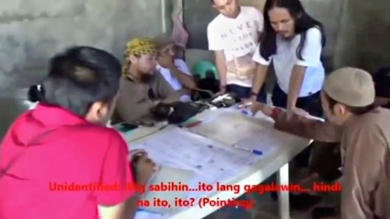 In this image from the Philippines' armed forces, Hapilon is said to be second on the left 