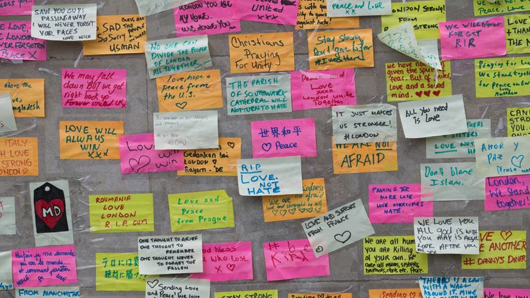 Messages of peace and defiance have been growing near the site of the attack