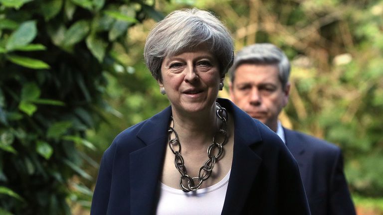 Theresa May arrives to attend Holy Communion at St Andrew's Church in Berkshire