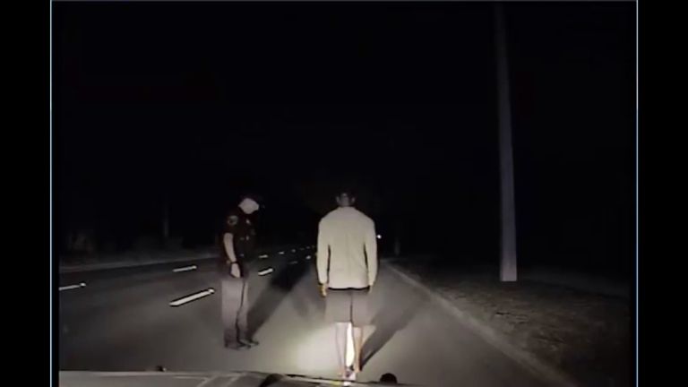 Police dashcam footage shows the golfer undergoing a sobriety check