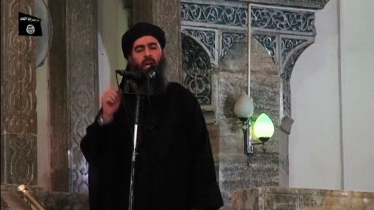 Baghdadi pictured at his first public appearance at a mosque in Mosul