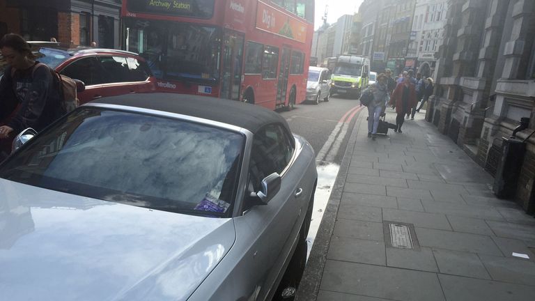 An Audi with a parking ticket on the windscreen