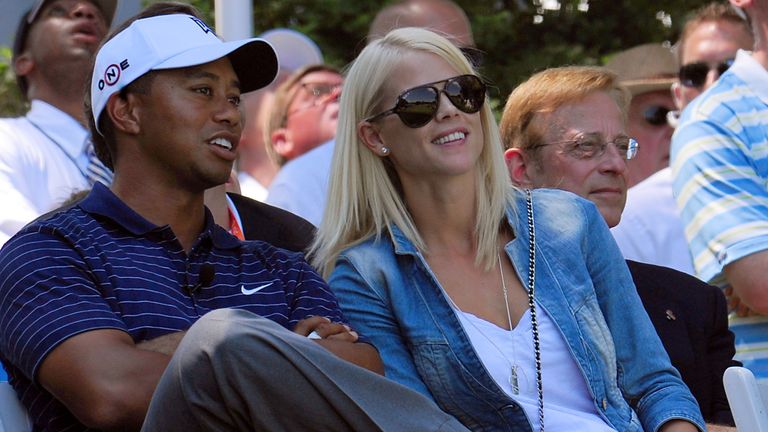 Tiger Woods chats with his then wife Elin Nordegren at a tournament in 2009 
