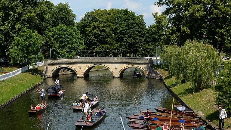 Sunseekers enjoy punting on the River Cam in Cambridge