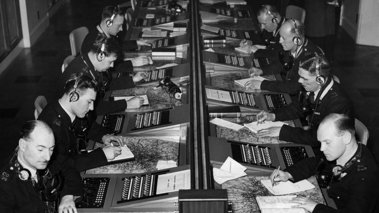 Operators at work dealing with &#39;999&#39; emergency calls in the new Information Room at New Scotland Yard in 1956
