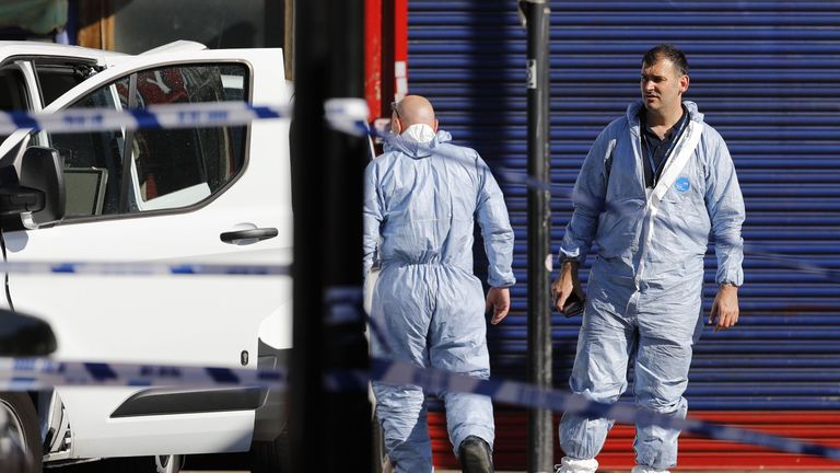 Forensic teams work at Finsbury Park following the terror attack