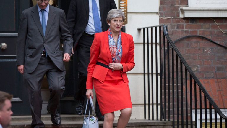 Prime Minister Theresa May leaves Conservative Party HQ in Westminster