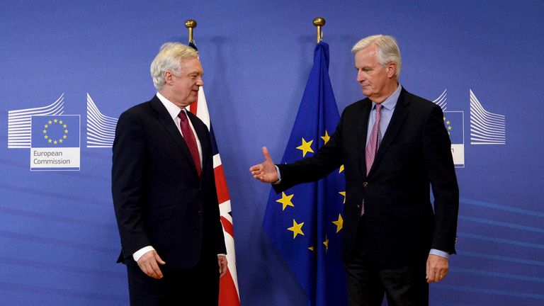 Michel Barnier offers his hand to Brexit Secretary David Davis as negotiations start in Brussels