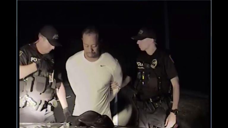 Dashcam footage shows Tiger Woods being arrested
