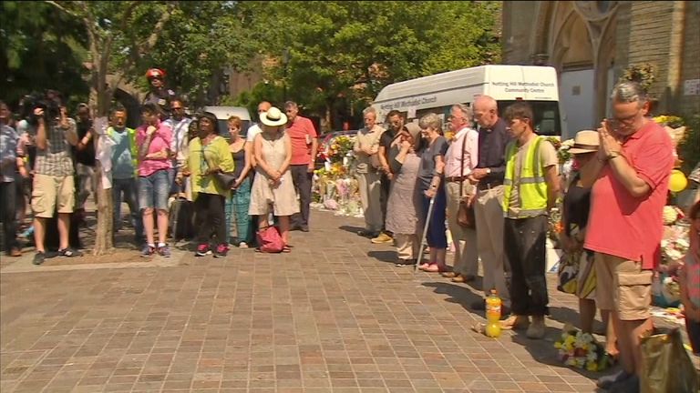 Residents observe a minute&#39;s silence near Grenfell Tower