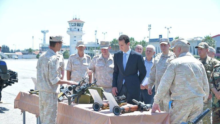 Syria&#39;s President Bashar al-Assad visits a Russian air base at Hmeymim, in western Syria