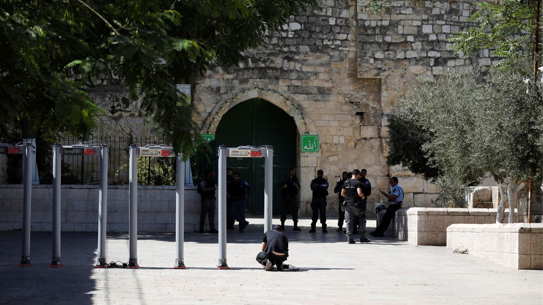 DATE IMPORTED:16 July, 2017A man installs metal detectors at an entrance to the compound known to Muslims as Noble Sanctuary and to Jews as Temple Mount, in Jerusalem's Old City July 16, 2017. REUTERS/Ronen Zvulun