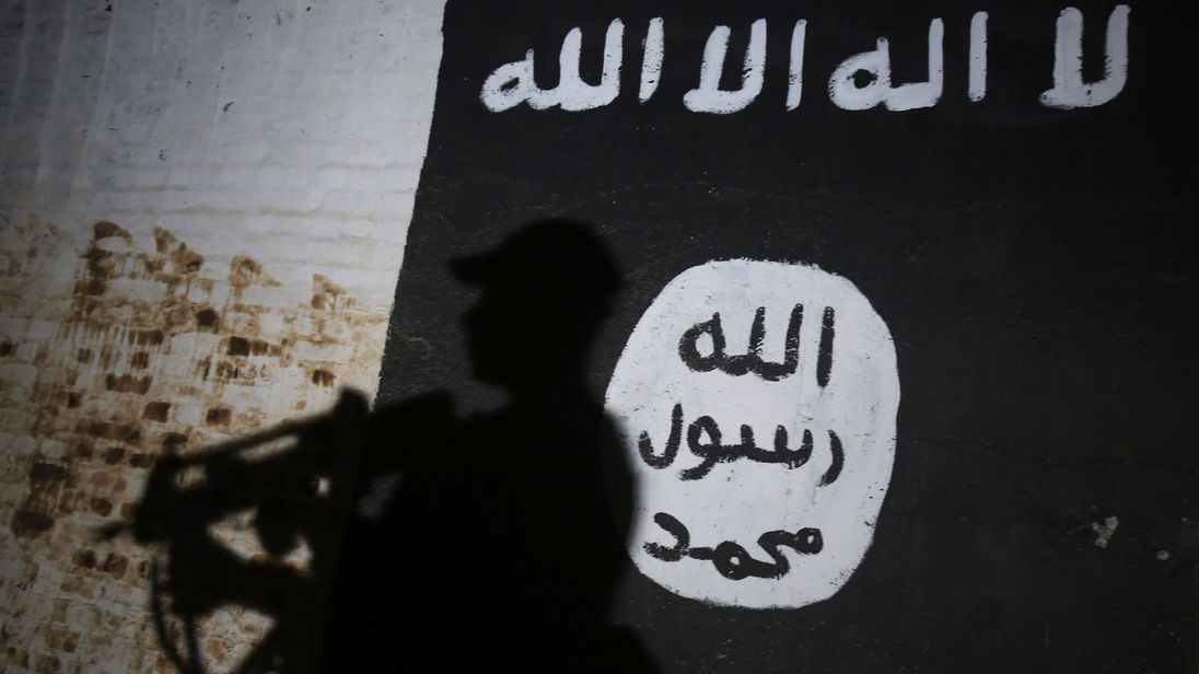 Mural bearing the logo of the Islamic State