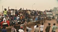 Supporters of a presidential candidate in CAR ride on a flatbed lorry, in an incident unrelated to the crash