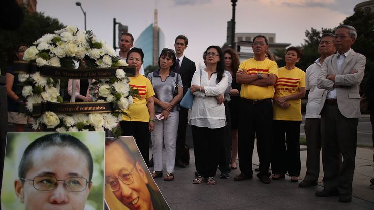 People gather together during a vigil in memory of Chinese Nobel Peace Prize laureate Liu Xiaobo on July 17, 2017 in Washington, DC. Liu, 61, died of multiple organ failure on July 13, 2017 as he was serving a 11-year prison term in China for the act of inciting subversion of state power