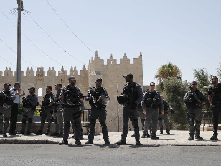 Israeli security forces stand guard following a shooting that left two officers dead