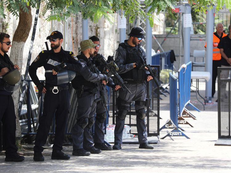 Israeli police officers stand guard next to recently installed metal detectors at an entrance to the compound known to Muslims as Noble Sanctuary and to Jews as Temple Mount in Jerusalem's Old City