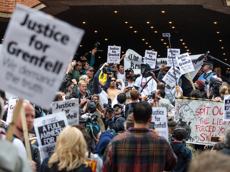 Protesters demonstrate outside the first full Kensington council meeting held since the Grenfell Tower fire which claimed at least 80 lives