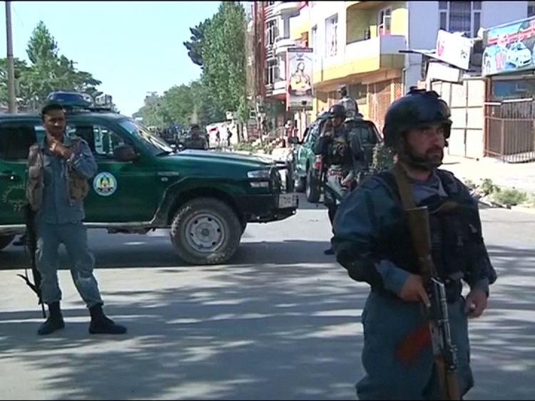 Police at the scene after a bomb in Kabul