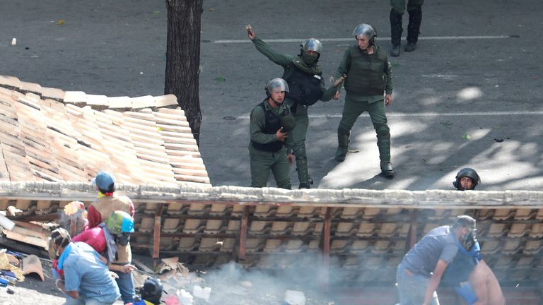 Demonstrators and riot security forces clash