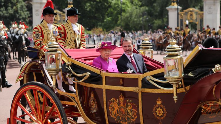 Queen Elizabeth II and King Felipe VI of Spain ride in a carriage during a State visit by the King and Queen of Spain at Centre Gate, Buckingham Palace 