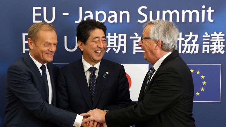 Donald Tusk, Shinzo Abe and Jean-Claude Juncker are all smiles
