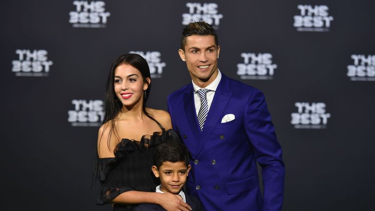 Real Madrid and Portugal&#39;s forward Cristiano Ronaldo poses with partner Georgina Rodriguez and his son Cristiano Ronaldo Jr as they arrive for The Best FIFA Football Awards 2016 ceremony, on January 9, 2017 in Zurich. / AFP / MICHAEL BUHOLZER (Photo credit should read MICHAEL BUHOLZER/AFP/Getty Images)
