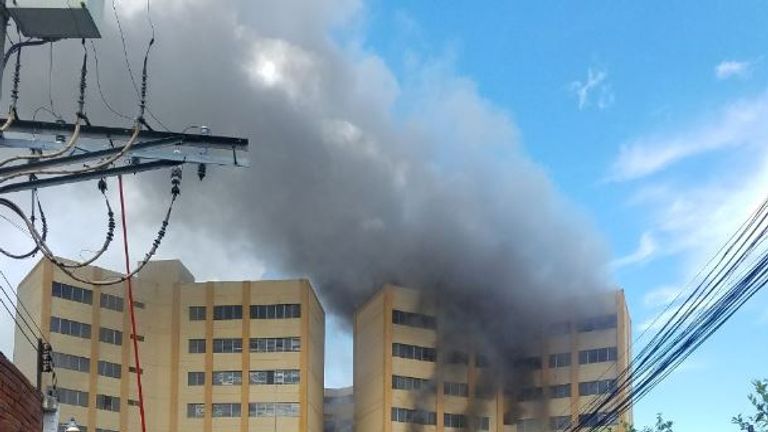 The Ministry of Finance building on fire in El Salvador. Pic: @ PROCIVILSV
