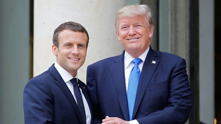 Emmanuel Macron greets Donald Trump in Paris