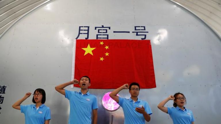 Volunteers take an oath before entering a simulated space cabin in which they will temporarily live. Pic: REUTERS/Damir Sagolj