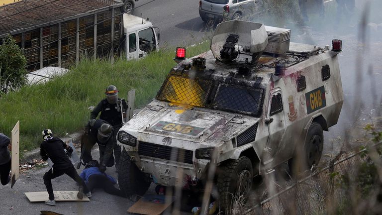 An armoured vehicle hits demonstrators 