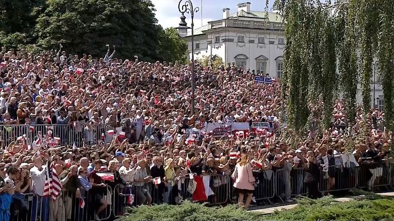 The crowd cheer Trump