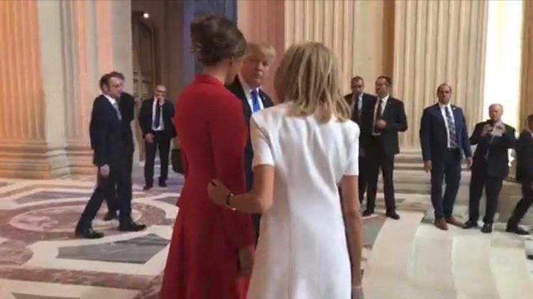 Brigitte Macron puts her arm round Melania Trump as Donald Trump says she is "in such good physical shape".