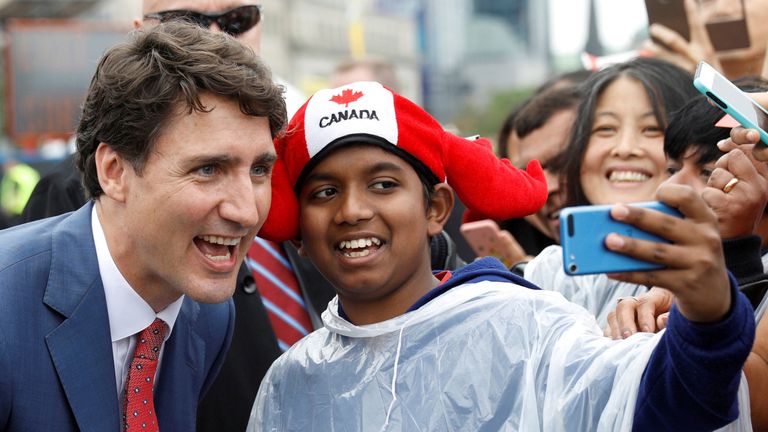 Canada&#39;s Prime Minister Justin Trudeau poses for a selfie during Canada Day celebrations