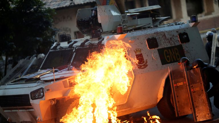 A riot security force vehicle is set on fire 