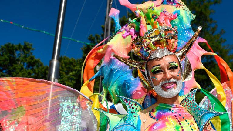 A man in an elaborate costume during the parade through the centre of Madrid