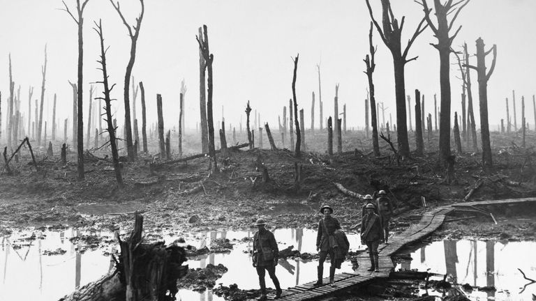 Australian troops walking along duckboards through the remains of Chateau Wood. Pic: Granger/REX/Shutterstock