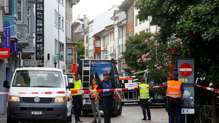 Swiss police officers stand at a crime scene in Schaffhausen, Switzerland 