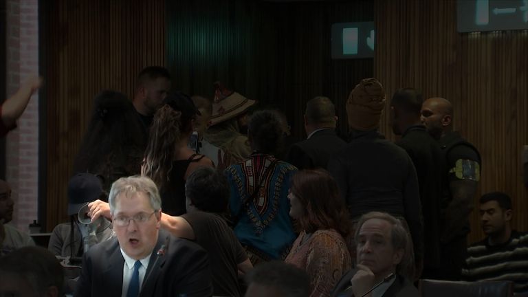 A councillor is seen mouthing &#39;don&#39;t let them in&#39;