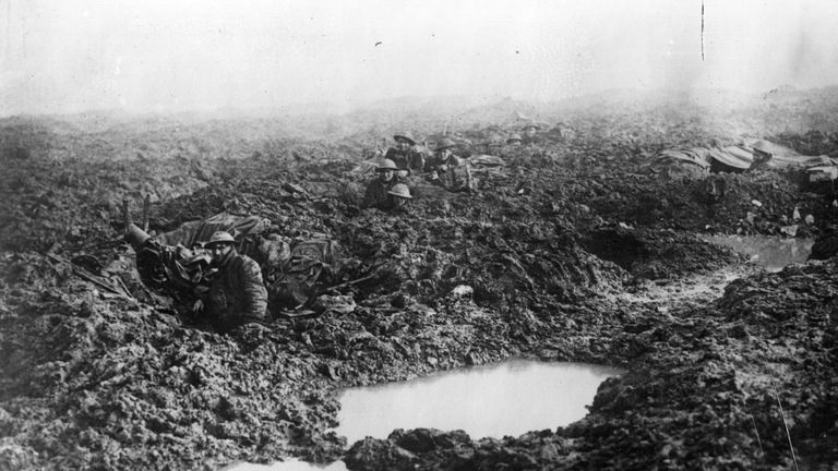 Soldiers of the 16th Canadian machine gun regiment using shell holes as makeshift defences at Passchendaele Ridge