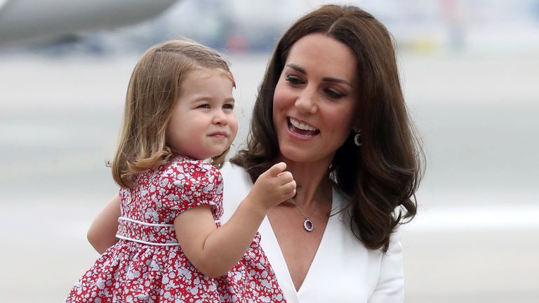 The Duchess of Cambridge carries Princess Charlotte