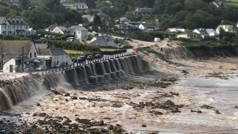 Floodwater pours through the village of Coverack in Cornwall. Pic: Mark Newman