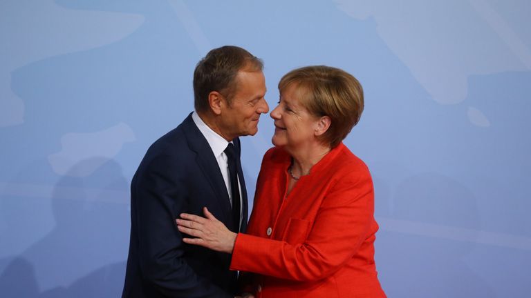 German Chancellor Angela Merkel greets European Council President Donald Tusk