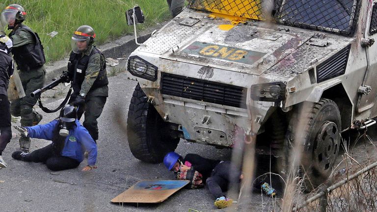 An armoured vehicle hits demonstrators 