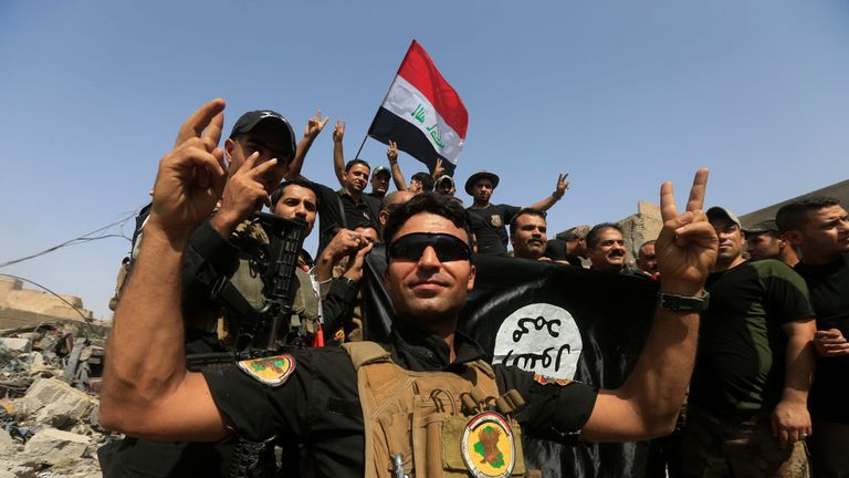 Iraqi Counter Terrorism Service celebrate in the Old City of Mosul