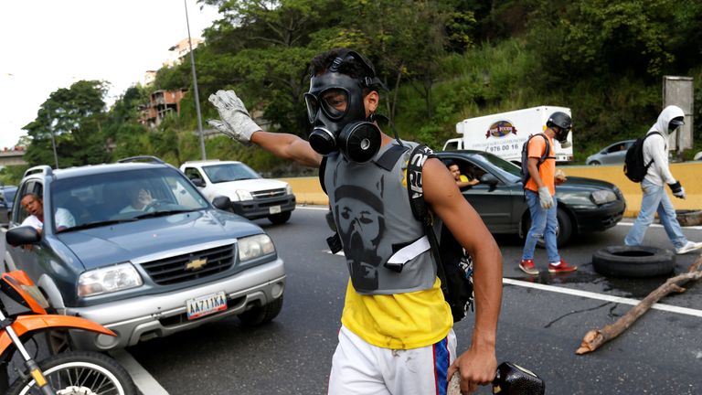 Demonstrators block a road during clashes 