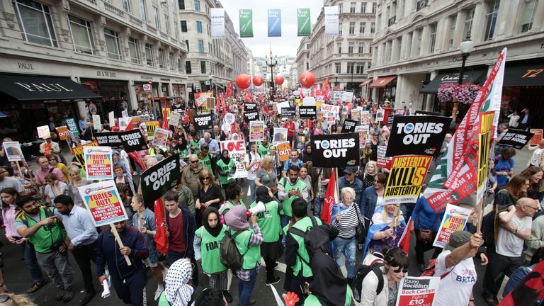 Anti-austerity campaigners march down Regent Street
