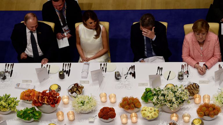 Mr Putin sat next to Melania Trump at a G20 banquet, with Angela Merkel on the right