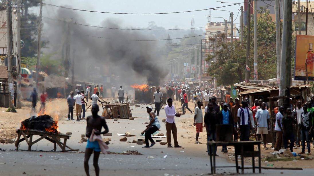 Demonstrators protesting the election results set barricades on fire in Kisumu
