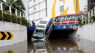 A vehicle damaged by Typhoon Hato is seen in Macau, China